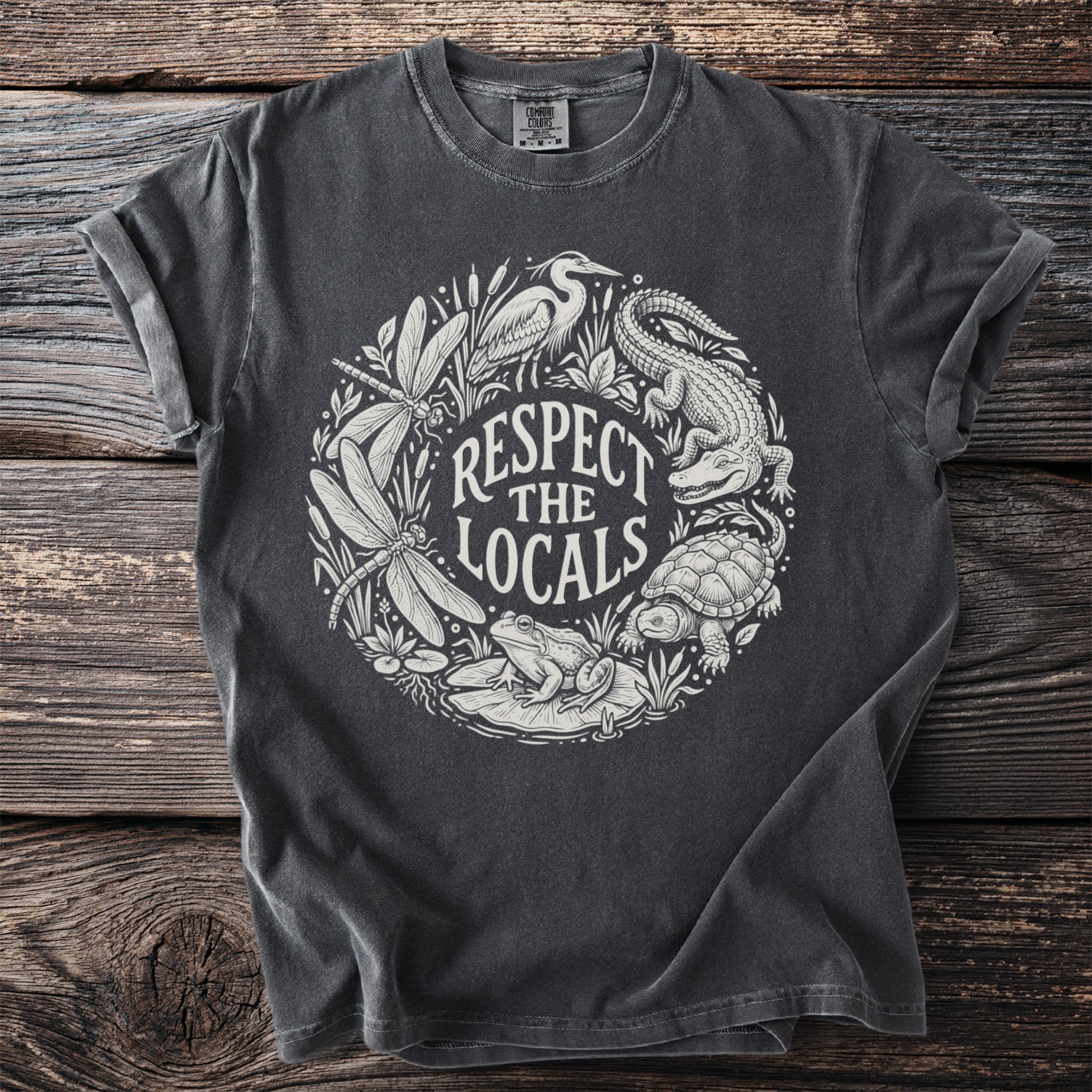 Dark grey t-shirt with white circular wildlife graphic and text "Respect The Locals".