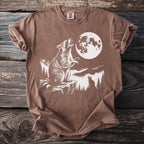 Brown t-shirt with graphic of raccoons howling at a full moon.