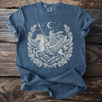 Blue t-shirt with Valkyrie riding a winged horse under a crescent moon.