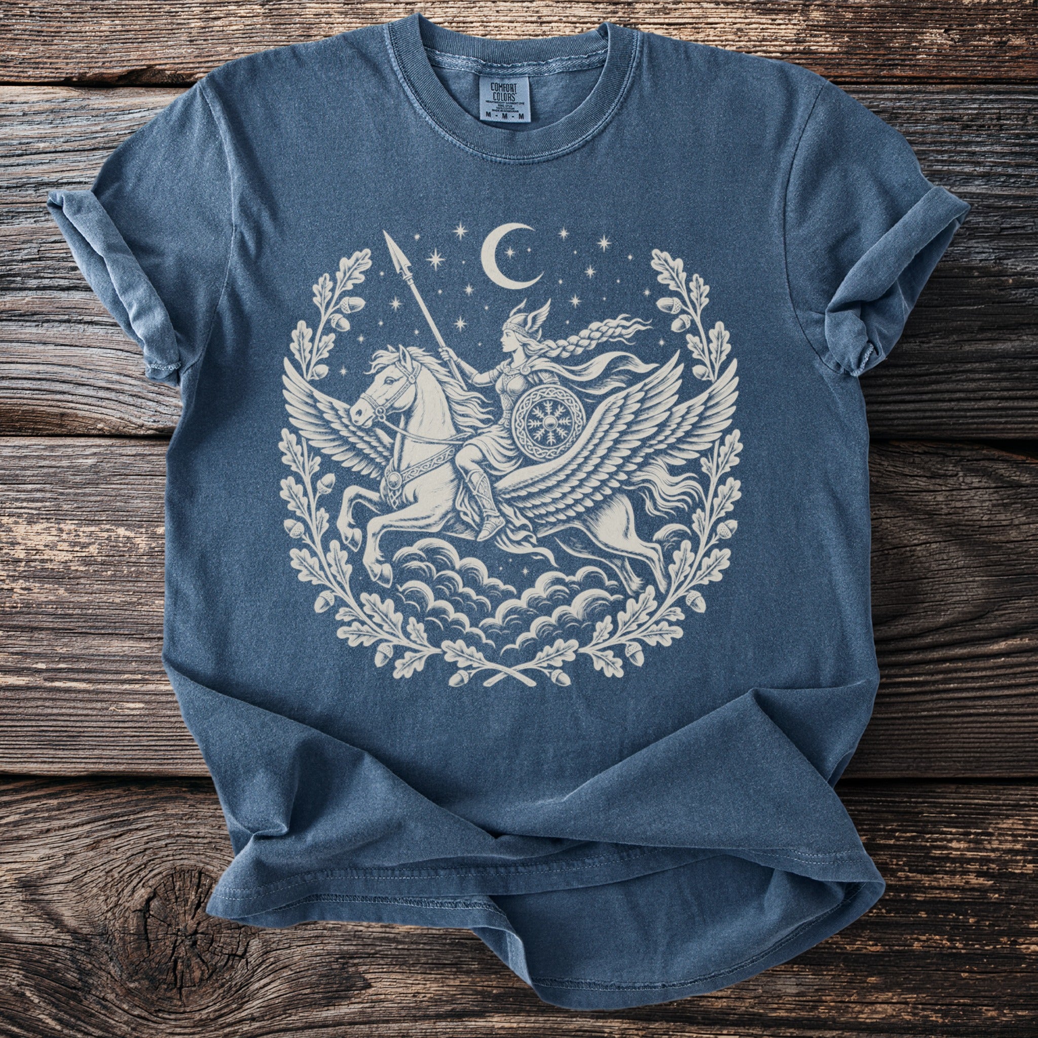 Blue t-shirt with Valkyrie riding a winged horse under a crescent moon.