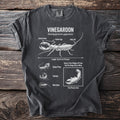 Vinegaroon anatomy diagram on a charcoal t-shirt showing pincer arms, feeler legs, and whip tail.