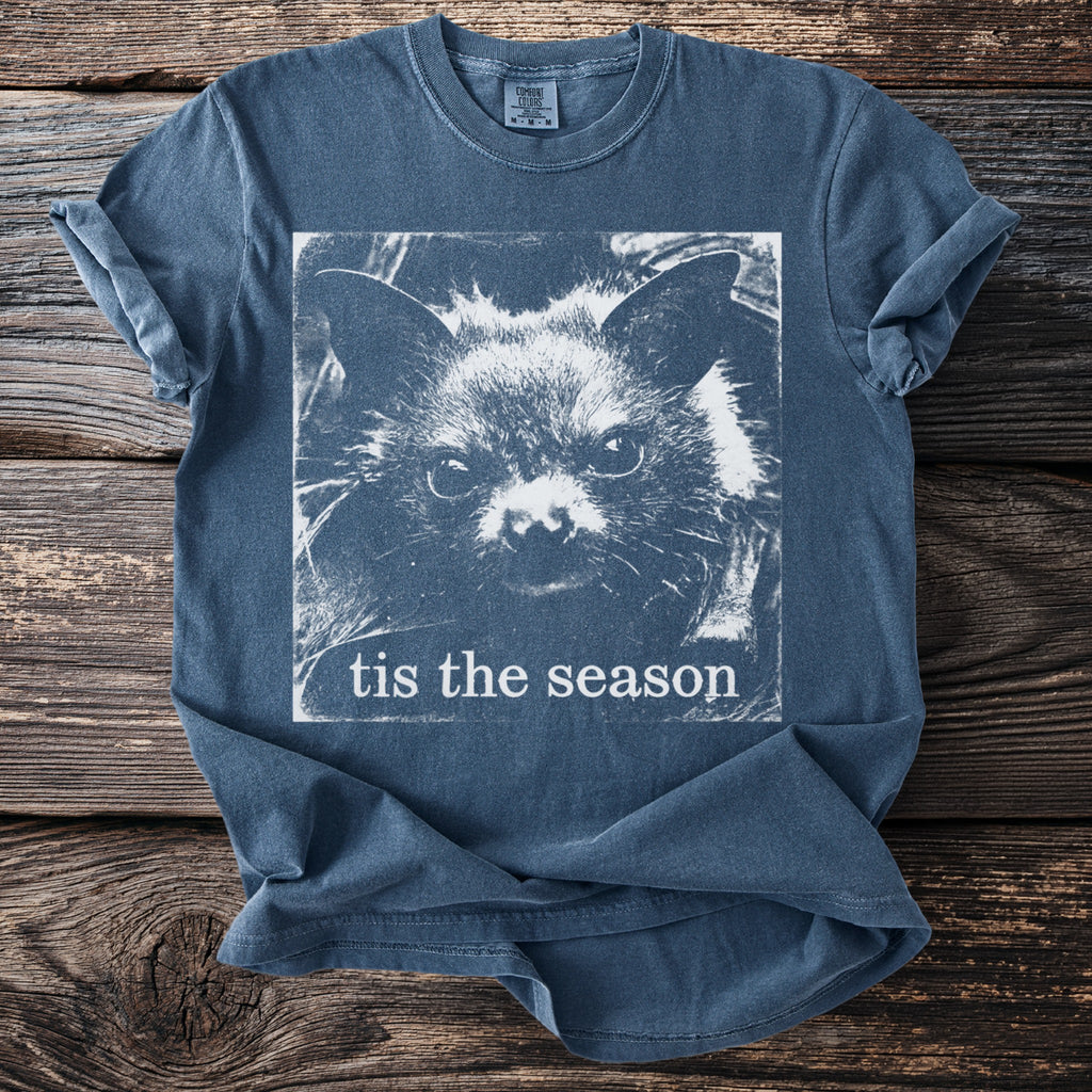 Blue t-shirt with a white bat face graphic and text "tis the season".