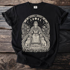 Black t-shirt with a beige Norse goddess sitting with two cats and celestial moon phases.