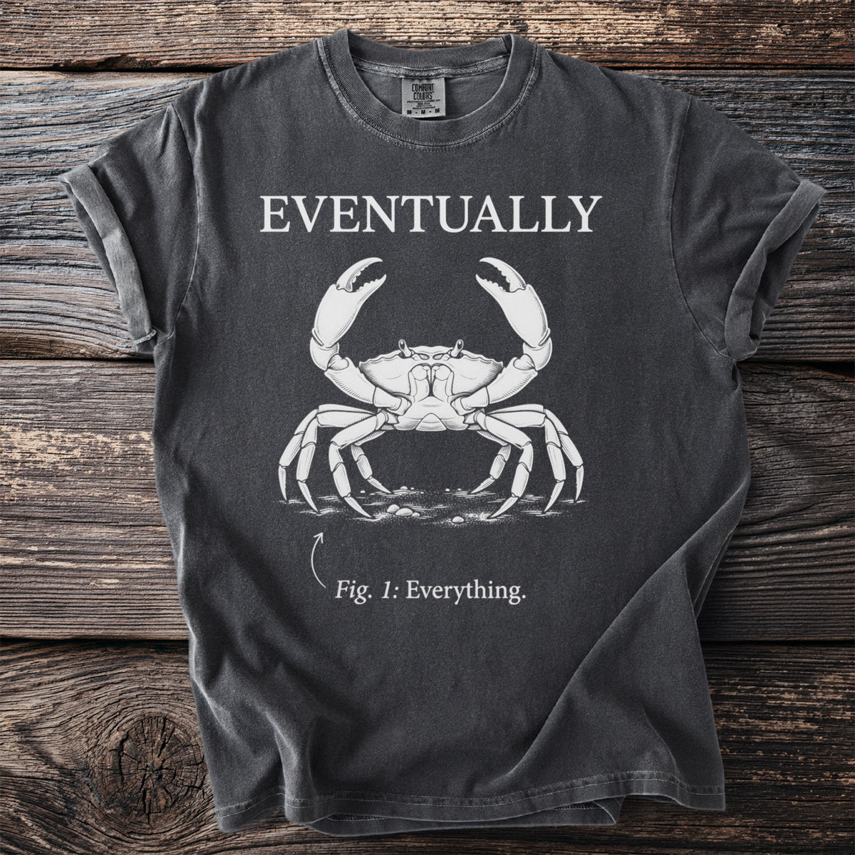 Dark t-shirt with a crab illustration and text "Eventually" and "Fig. 1: Everything."
