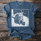 Blue t-shirt with a graphic of a smoking cat holding a coffee cup.