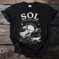 Black t-shirt with "SOL norse mythology sun goddess" and a chariot pulled by horses and wolves.