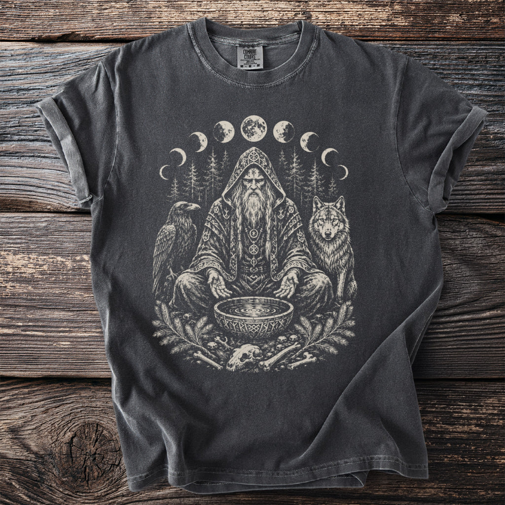 T-shirt features a seated wizard with a raven, wolf, and moon phases graphic.