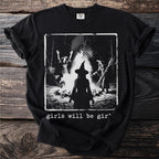 Black t-shirt with a graphic of three witches around a bonfire, text reads "girls will be girl".