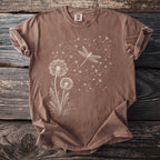 Brown t-shirt with a white line drawing of dandelions and a dragonfly.