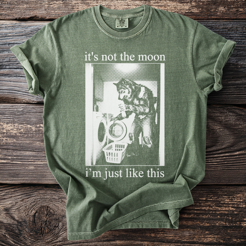 Green t-shirt with werewolf doing laundry graphic and text: "it's not the moon i'm just like this".