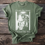 Green t-shirt with werewolf doing laundry graphic and text: "it's not the moon i'm just like this".