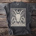 Dark gray t-shirt with a black and beige print of a goat skull, ravens, and runes.