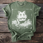 Green t-shirt with a white graphic of a hamster holding a treat.