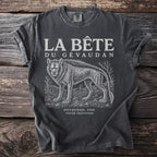 T-shirt with "La Bête du Gévaudan" text and illustration of a wolf-like creature.