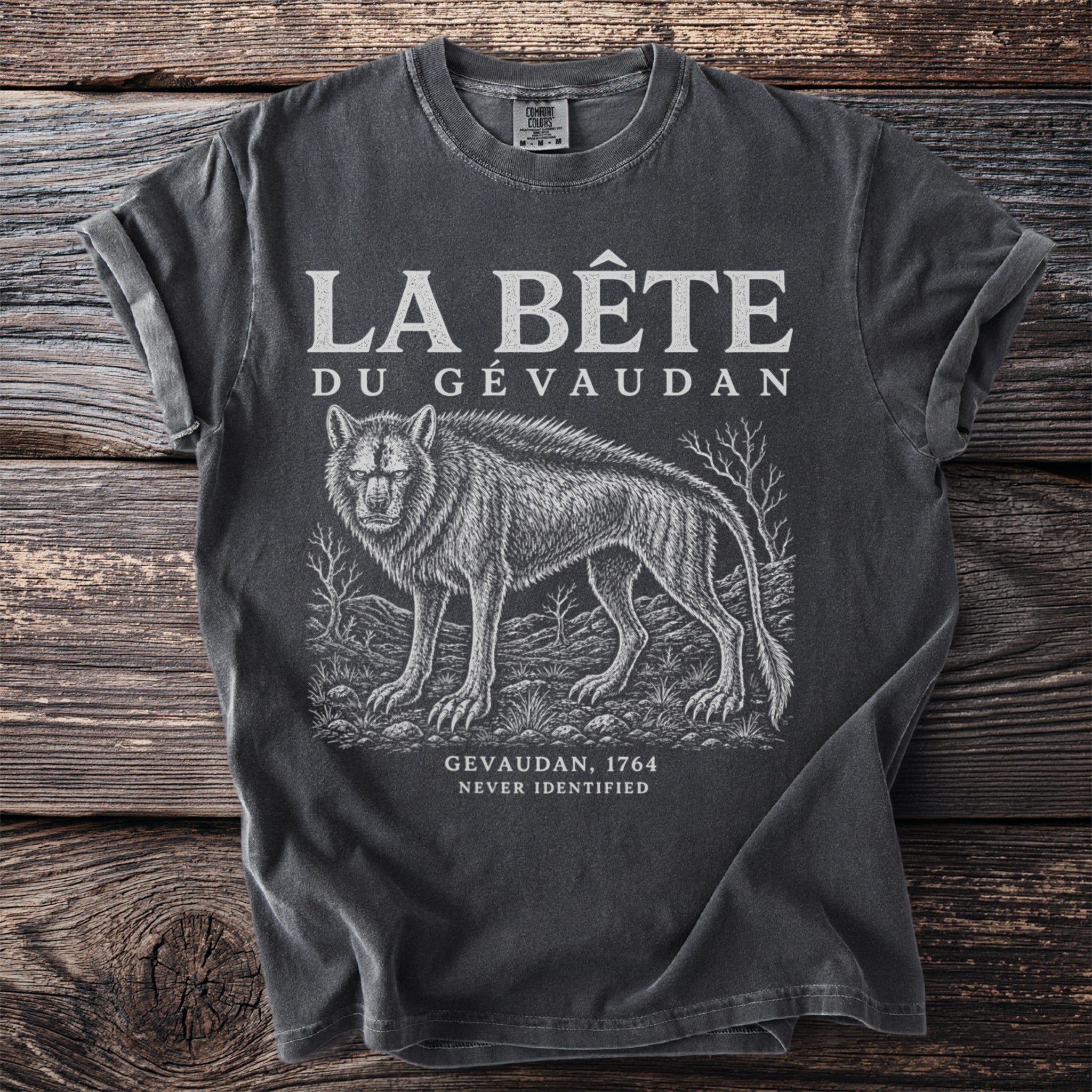 T-shirt with "La Bête du Gévaudan" text and illustration of a wolf-like creature.