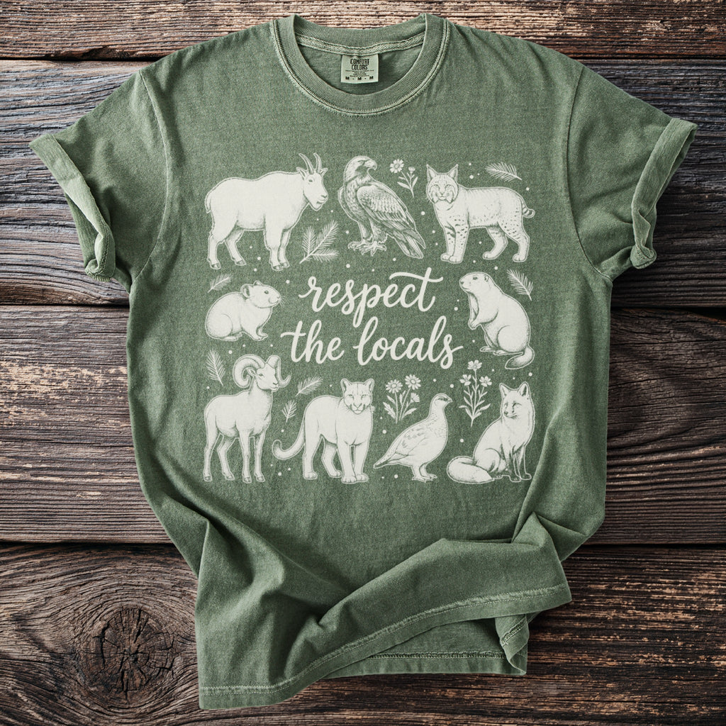 Green t-shirt with white line art of various animals and the text "respect the locals".