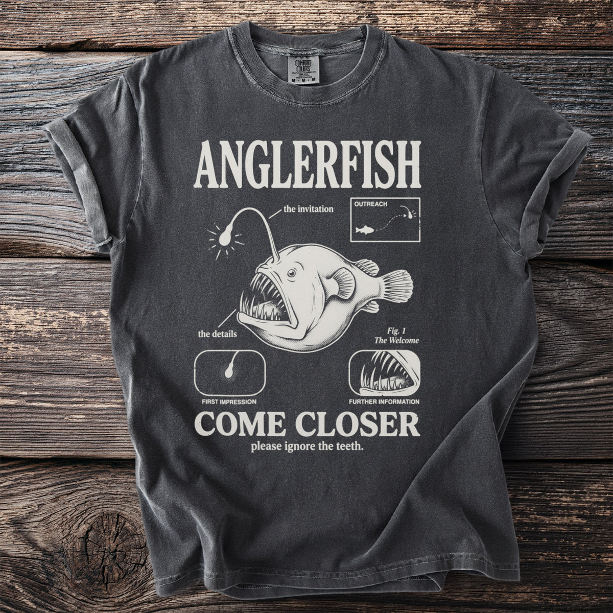 Dark gray t-shirt with Anglerfish graphic and text "COME CLOSER please ignore the teeth."