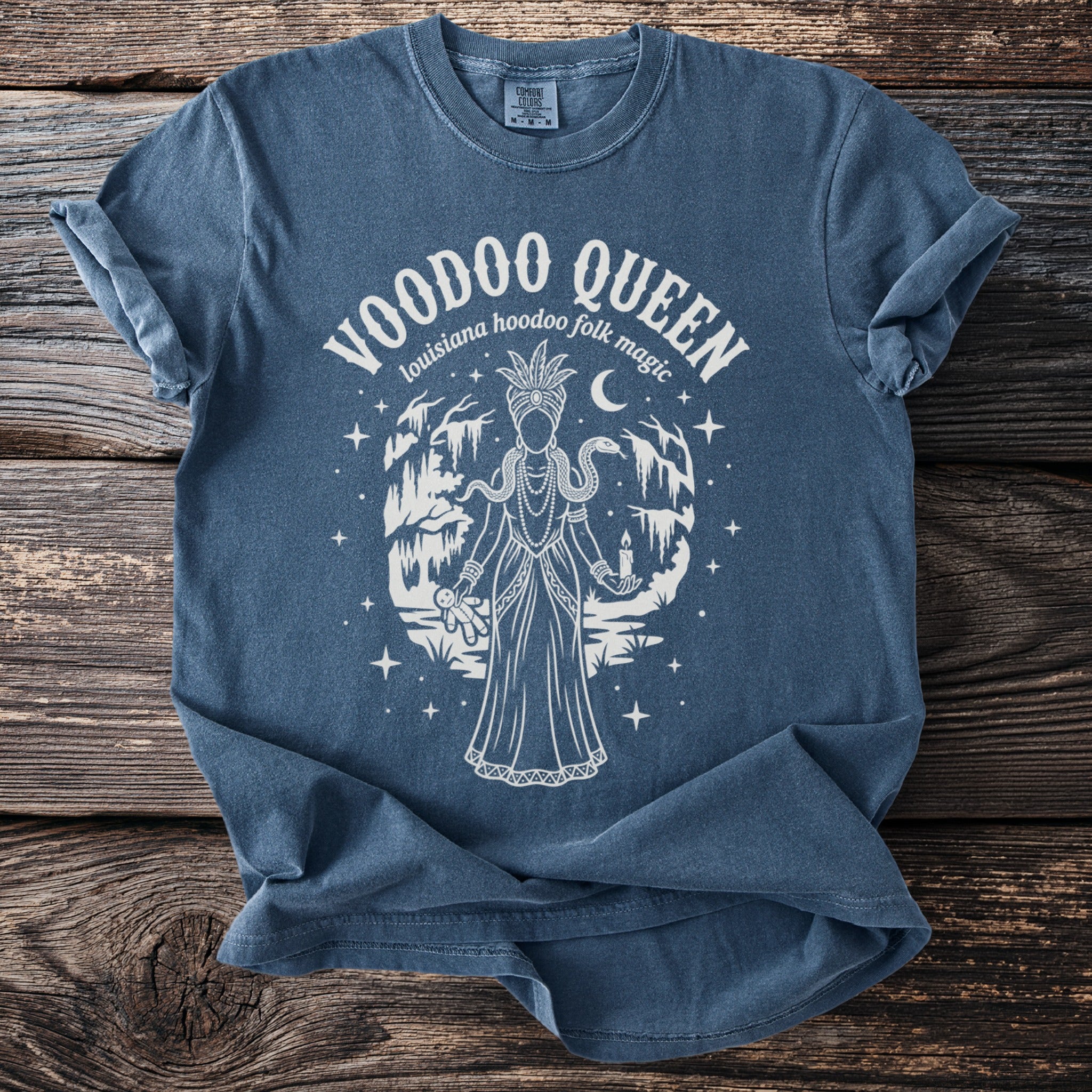 Blue t-shirt with Voodoo Queen design, featuring Louisiana hoodoo folk magic text.