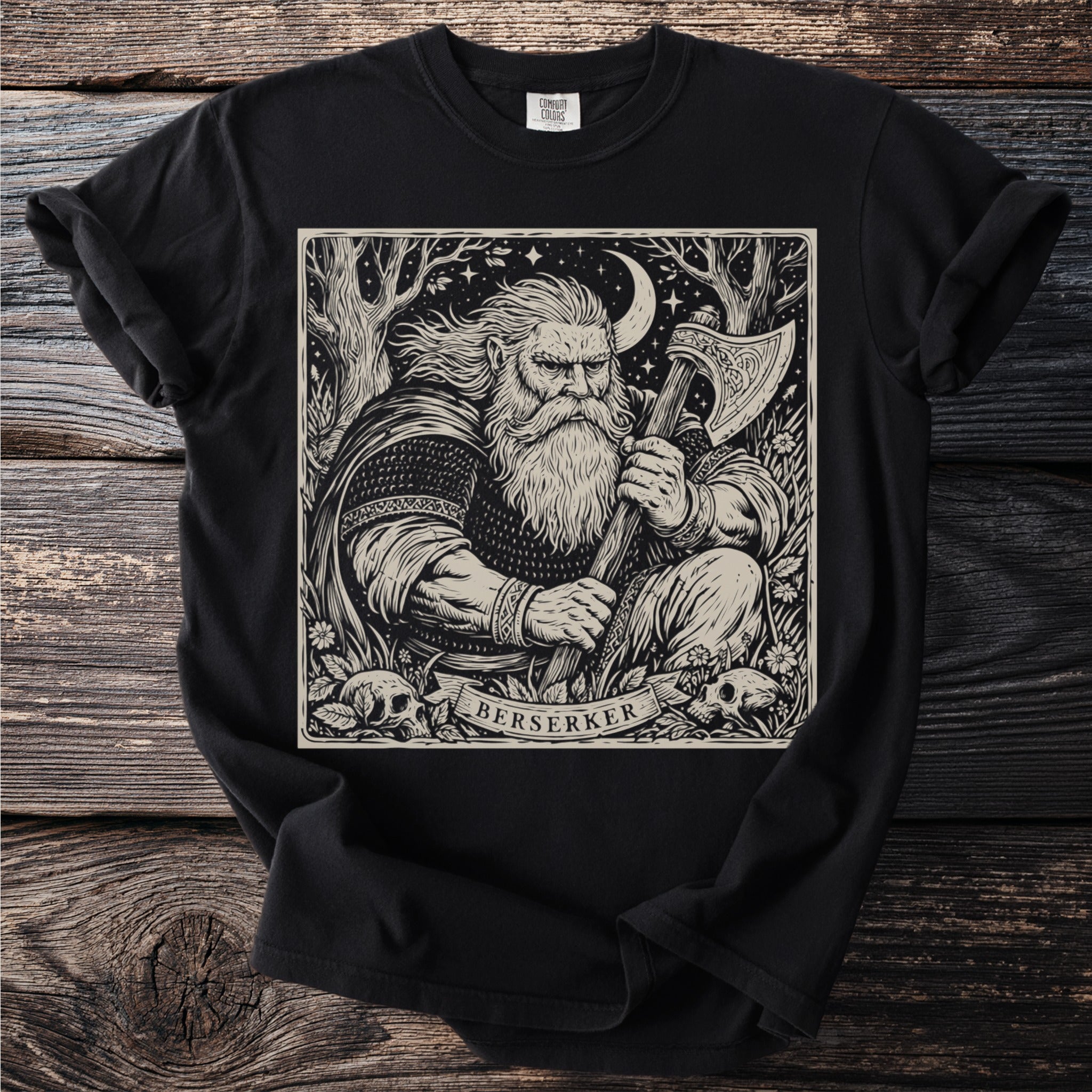 Berserker viking with axe and skulls artwork on a black t-shirt.