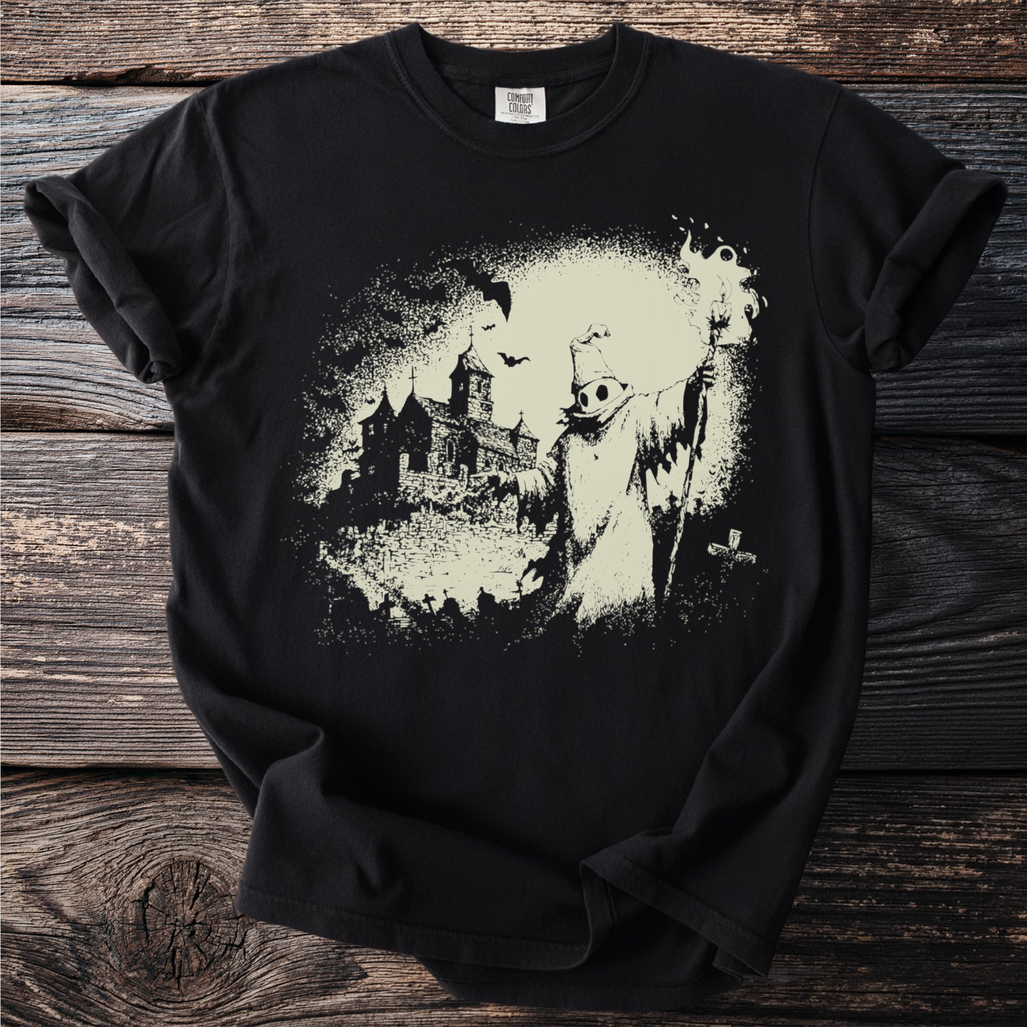 Black t-shirt with a graveyard, haunted house, and robed figure graphic.