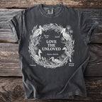 Dark grey t-shirt features "Love The Unloved" text and illustrations of birds.