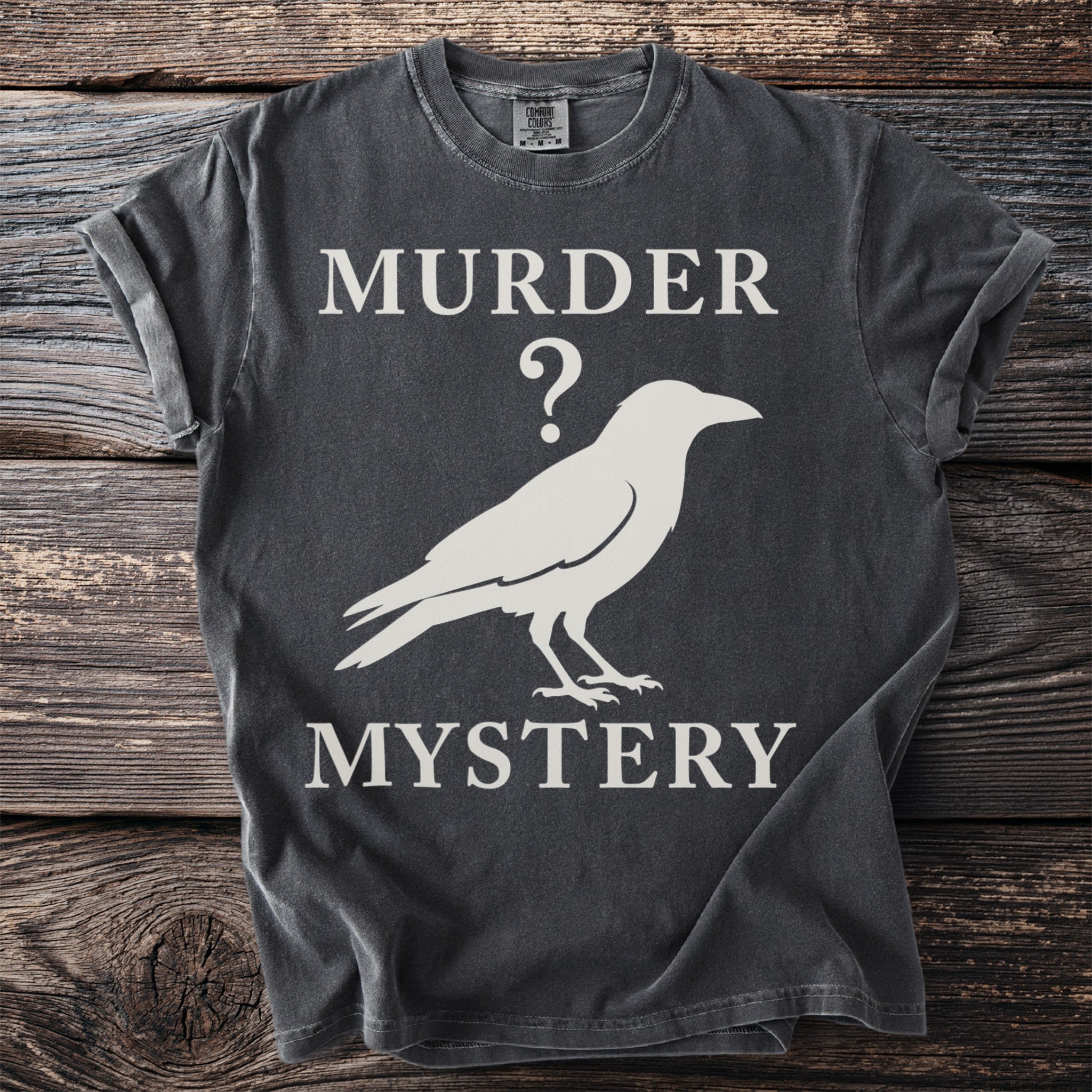 Dark grey t-shirt with white text "MURDER ?" and a crow silhouette, "MYSTERY".