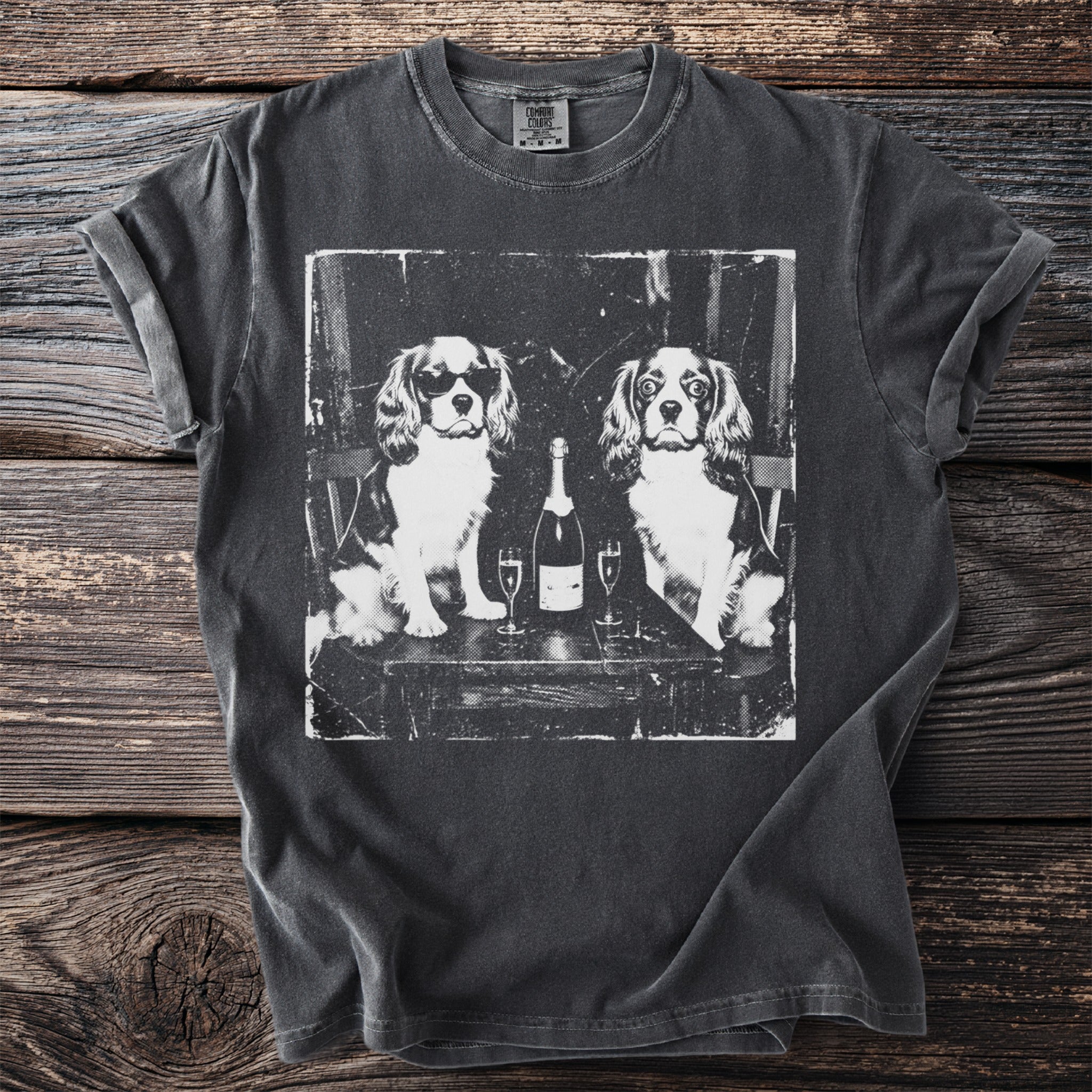 T-shirt with a black and white graphic of two Cavalier King Charles Spaniels with champagne.