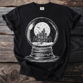 Black t-shirt with a white graphic of a haunted house in a snow globe.