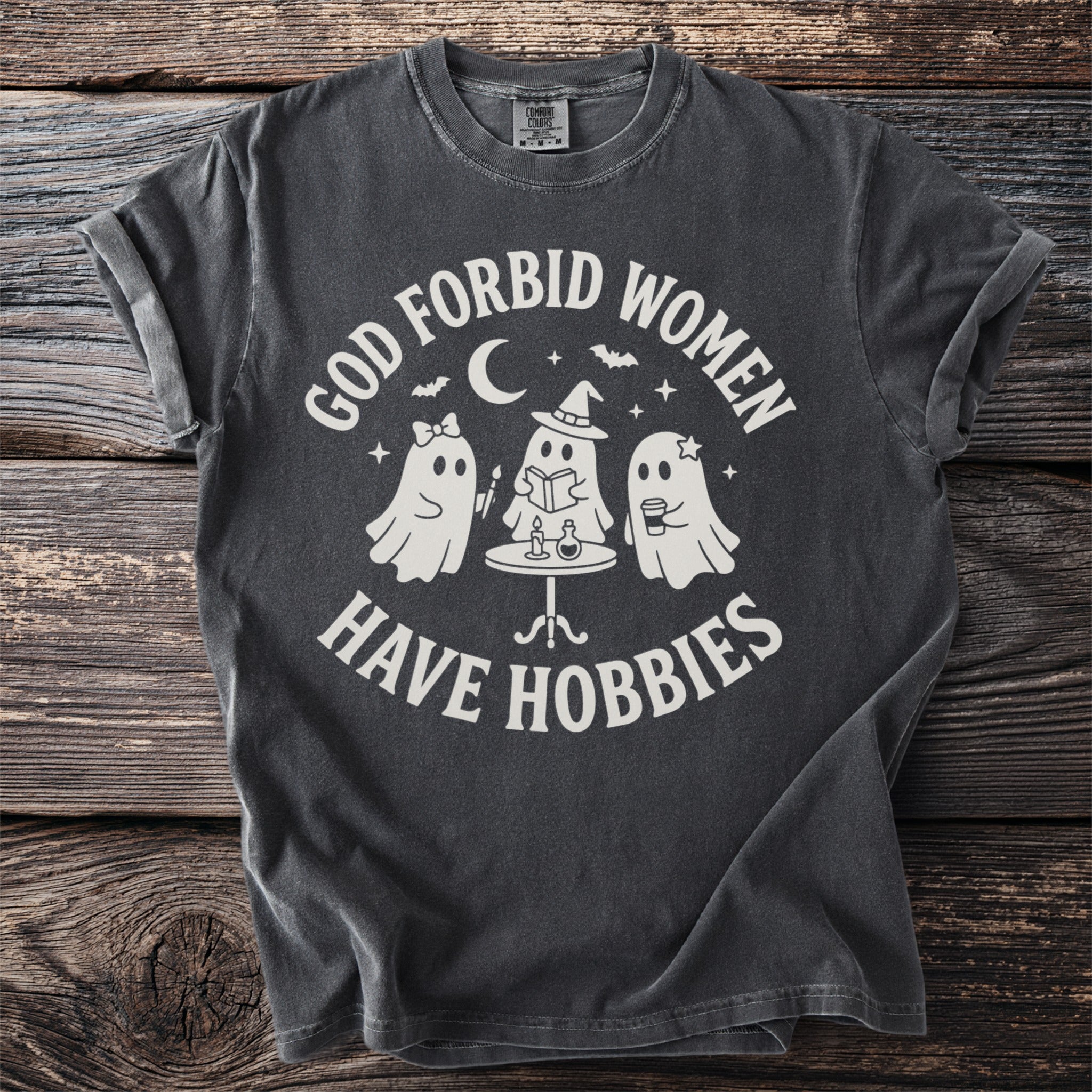 Ghost design with text "GOD FORBID WOMEN HAVE HOBBIES".