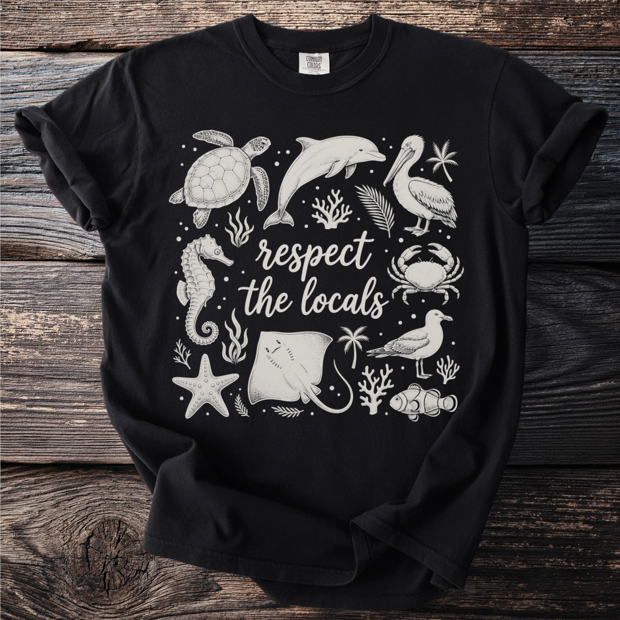 Black t-shirt with "respect the locals" text and a collage of sea creatures.