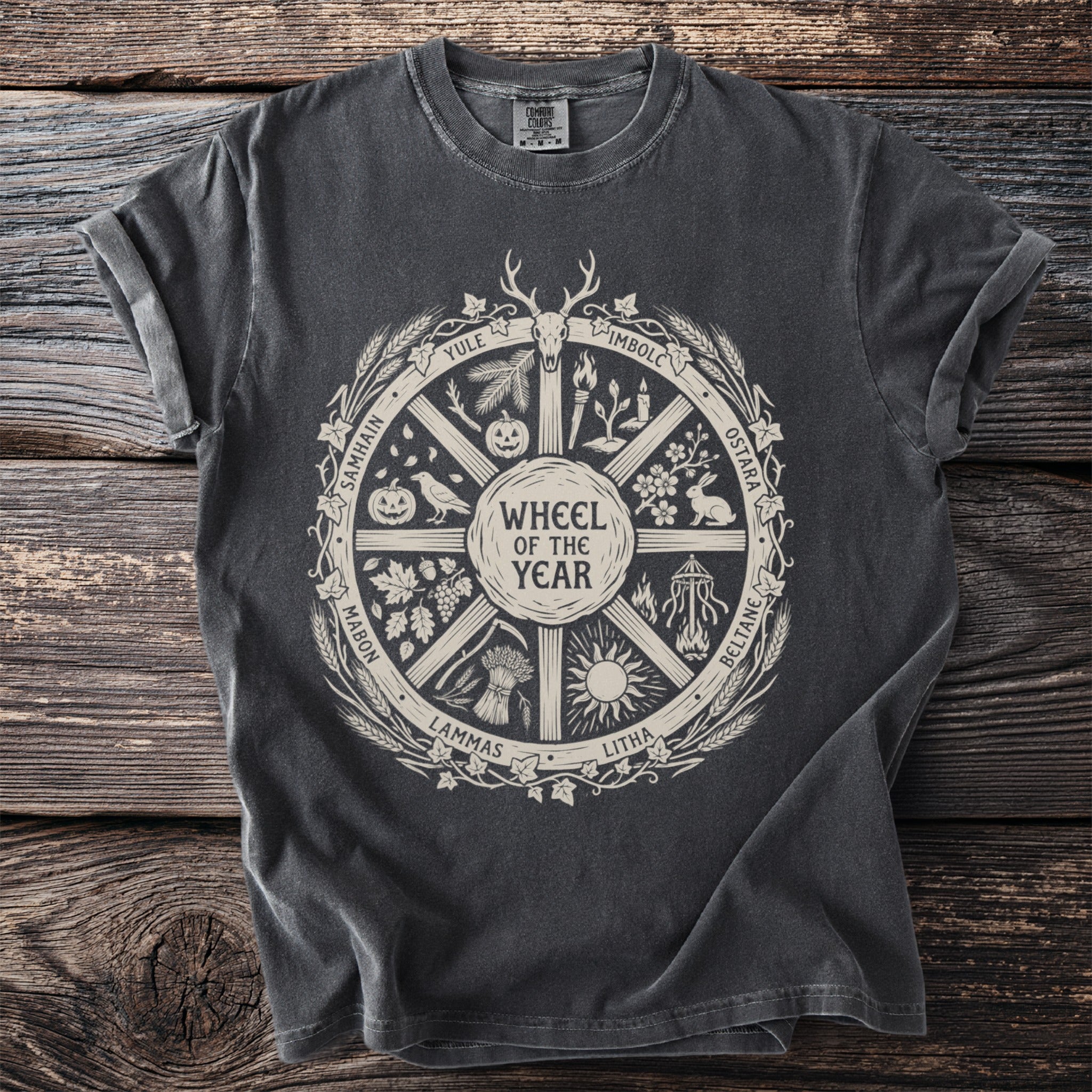Dark grey t-shirt with a cream "Wheel of the Year" graphic.