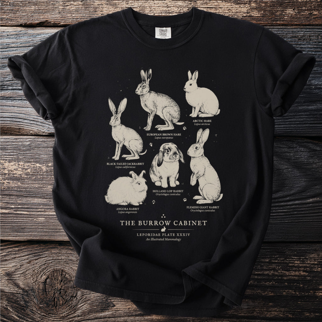 Black t-shirt with scientific illustrations of six rabbit breeds under "The Burrow Cabinet".