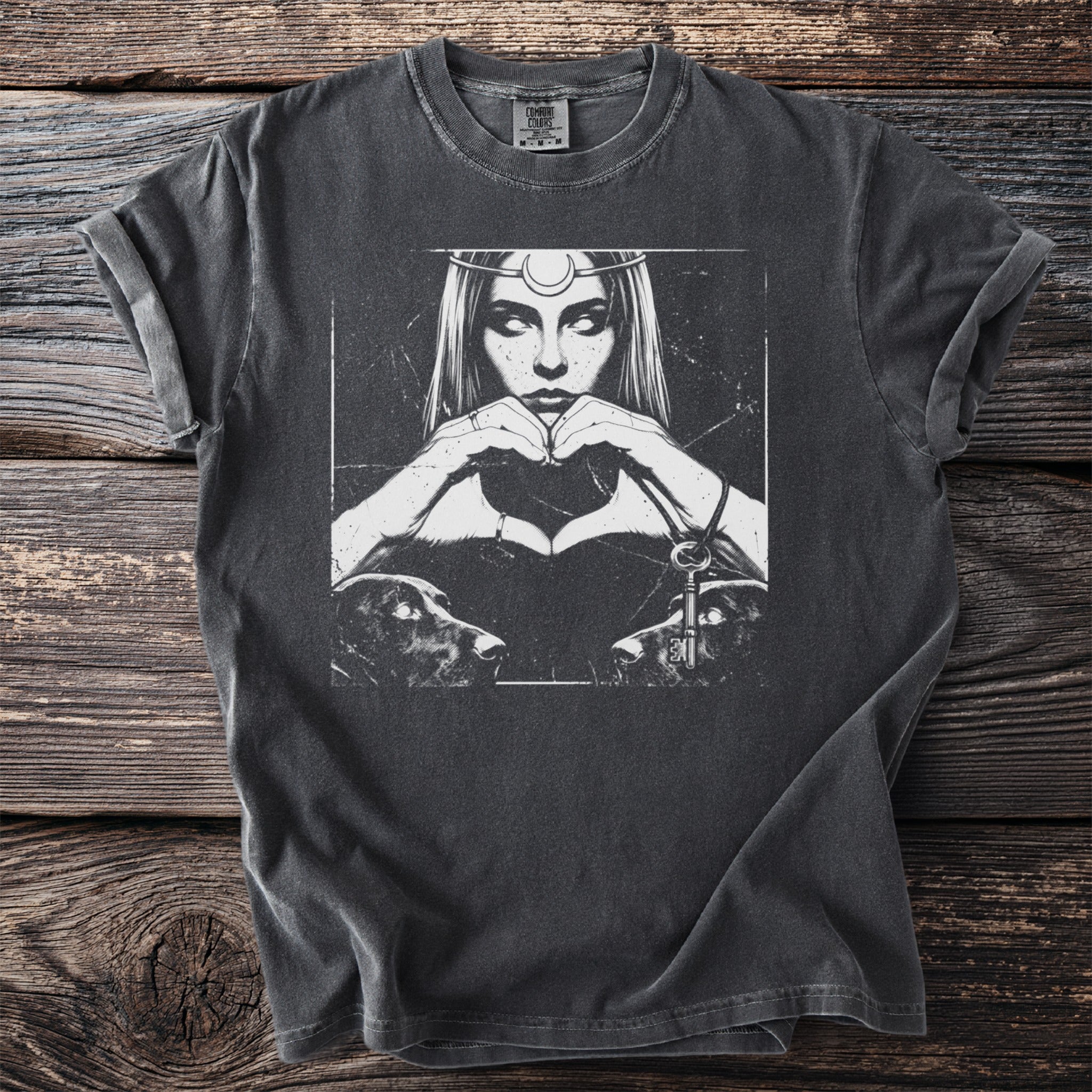 Graphic t-shirt with a woman, dogs, and key design on a dark background.