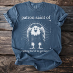 Blue t-shirt with "patron saint of" and a vulture graphic.