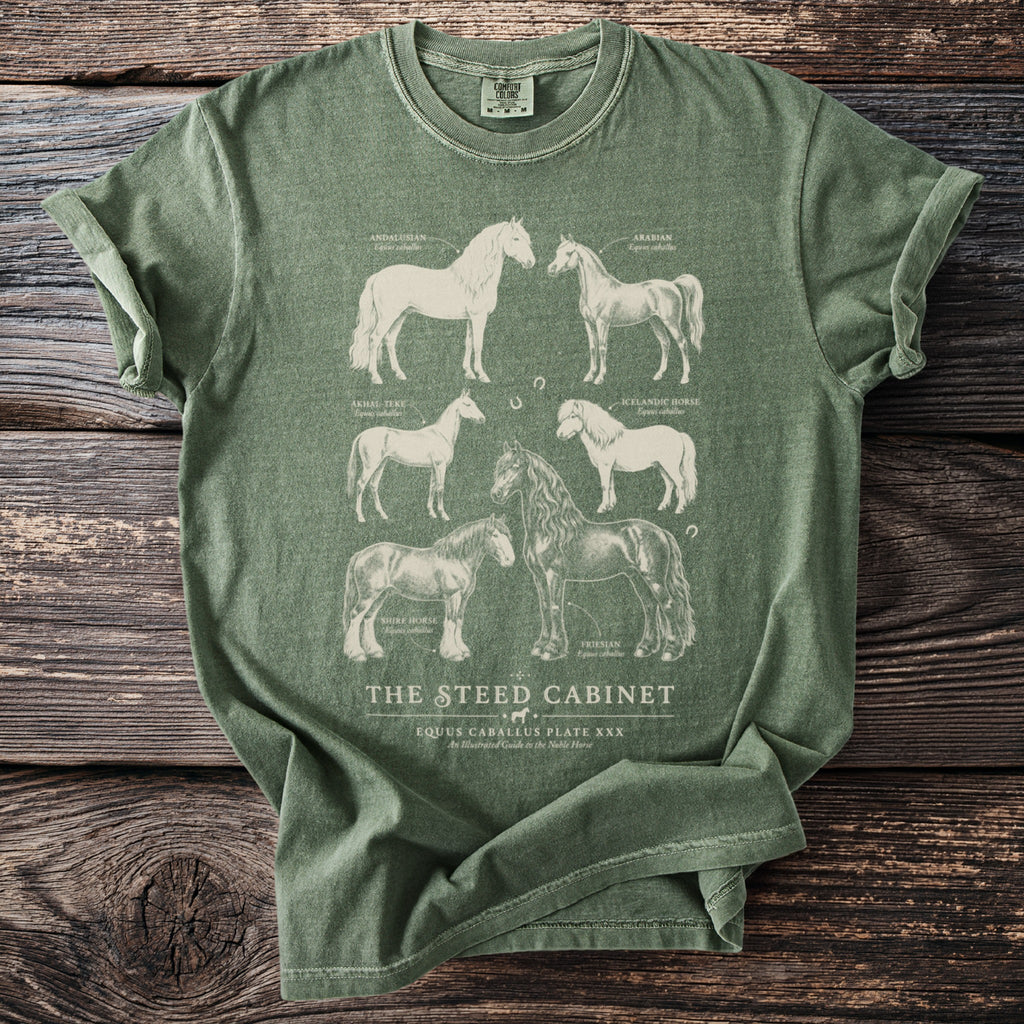 Green t-shirt with illustrations of six horse breeds and text "The Steed Cabinet".