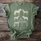 Green t-shirt with illustrations of six horse breeds and text "The Steed Cabinet".