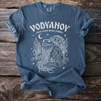 Blue t-shirt with white illustration "Vodyanoy slavic water demon folklore" and a frog.