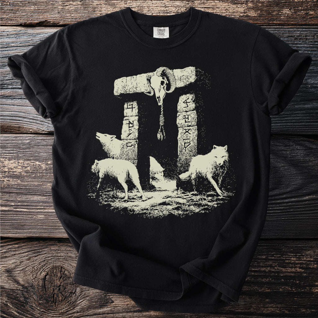 Three wolves beneath a stone arch with a ram skull and runic inscriptions.