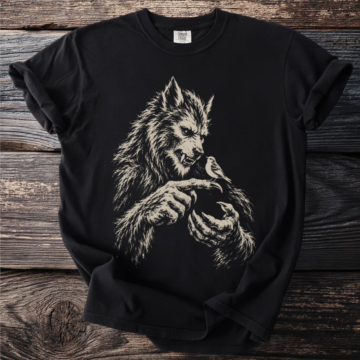 Black t-shirt with a detailed werewolf illustration holding a small bird.