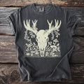 Charcoal t-shirt with a cream-colored graphic of a deer skull with antlers and botanical elements.
