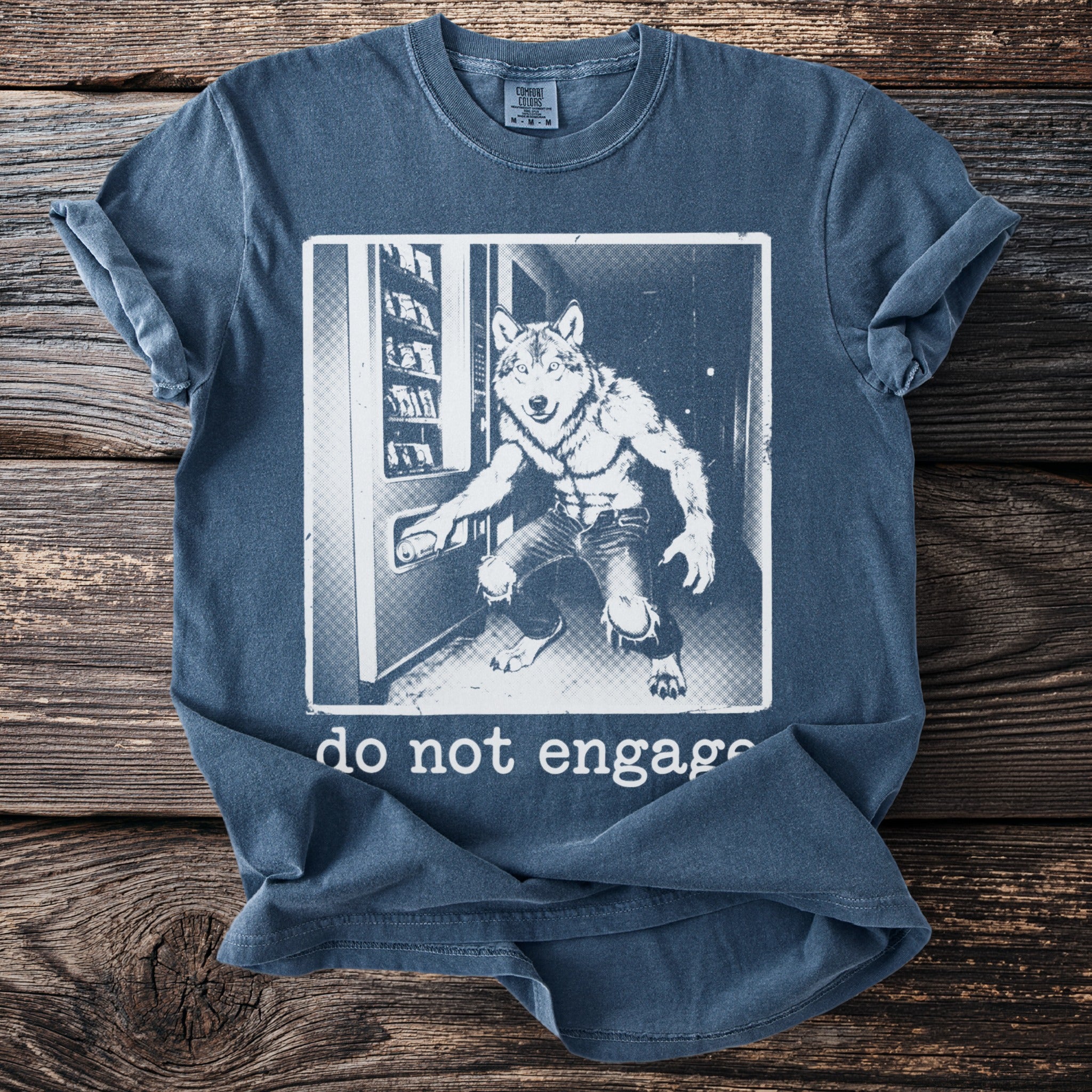 T-shirt with a graphic of a werewolf at a vending machine and the text "do not engage".