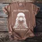 Brown t-shirt with white screen-print of a pigeon and text "no thoughts head empty".