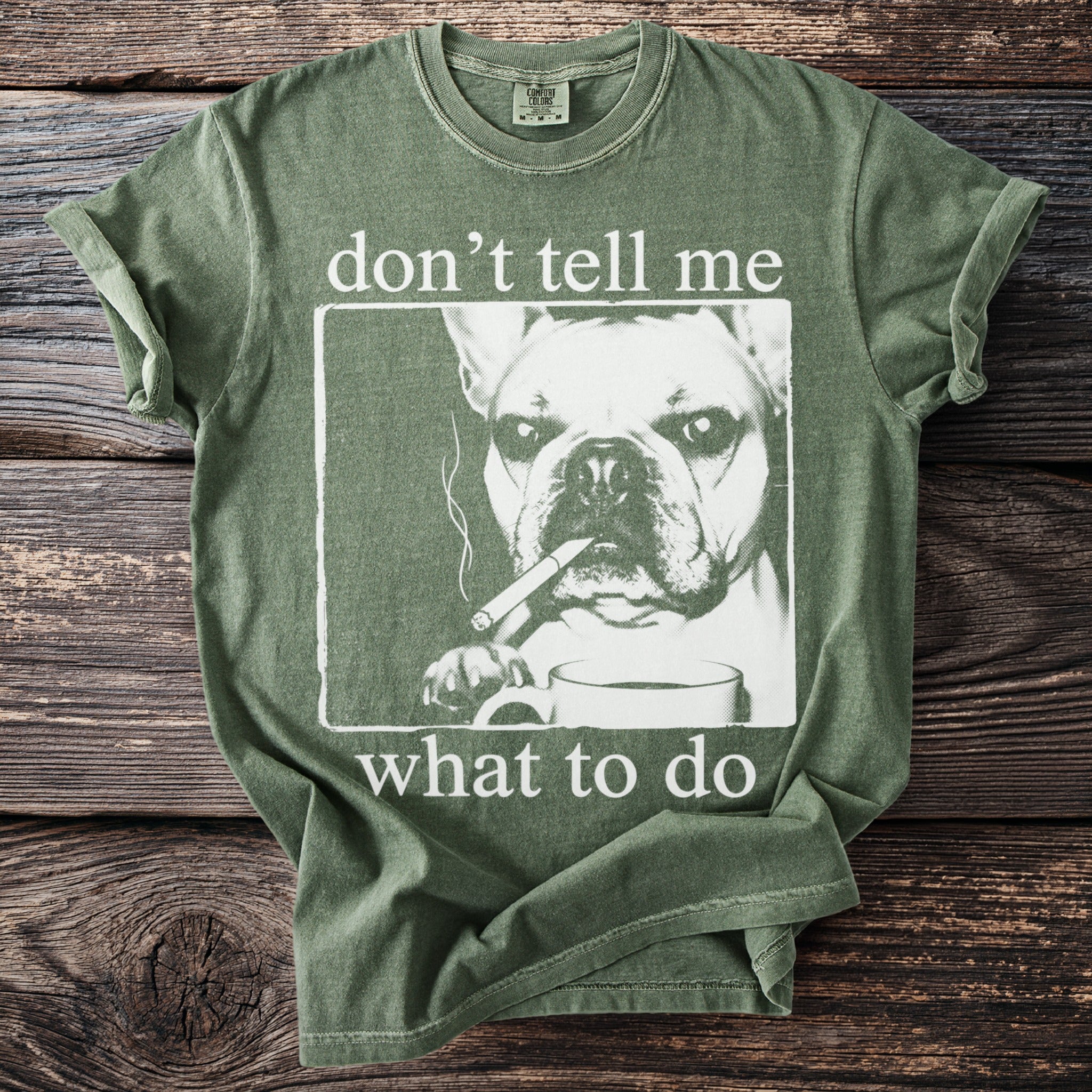 Olive green t-shirt with French bulldog smoking and holding coffee mug graphic, featuring text.