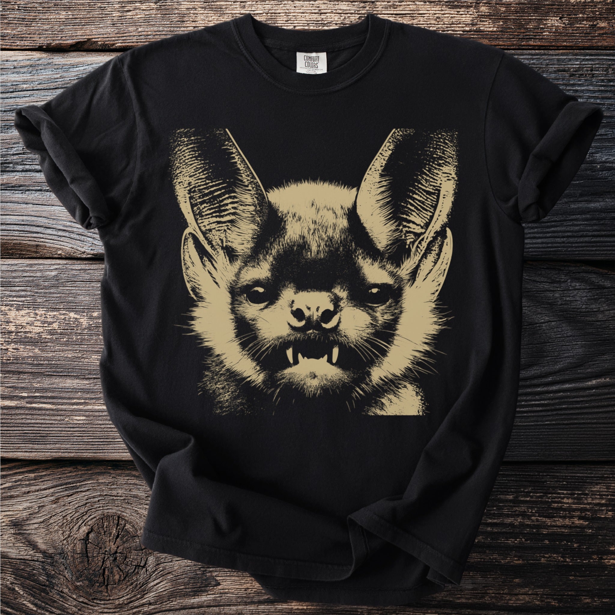 Black t-shirt with a tan screenprint of a bat's face.