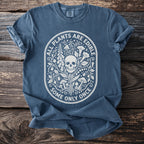Blue t-shirt with white graphic of skull, plants, and mushrooms, text "ALL PLANTS ARE EDIBLE SOME ONLY ONCE".