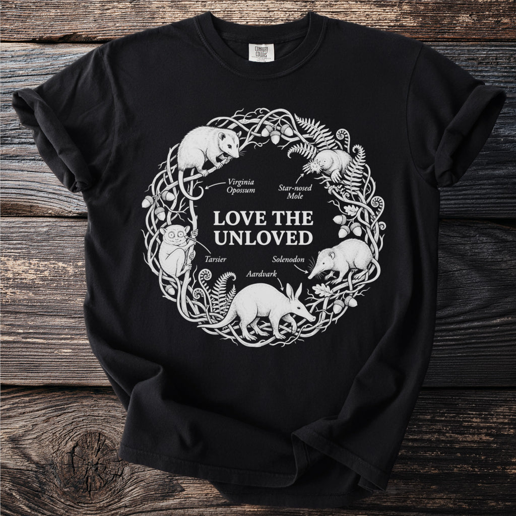 Black t-shirt with white line art of "Love the Unloved" animals in a circular wreath design.