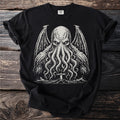 Black t-shirt with a white illustration of a tentacled creature and a lighthouse.