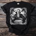 Black t-shirt with a white graphic of a vampire opening a coffin with bats overhead.