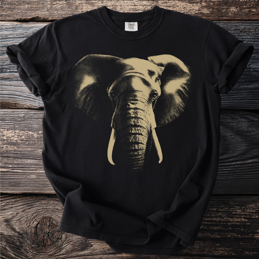 Black t-shirt with a gold, detailed elephant face graphic and Comfort Colors tag.