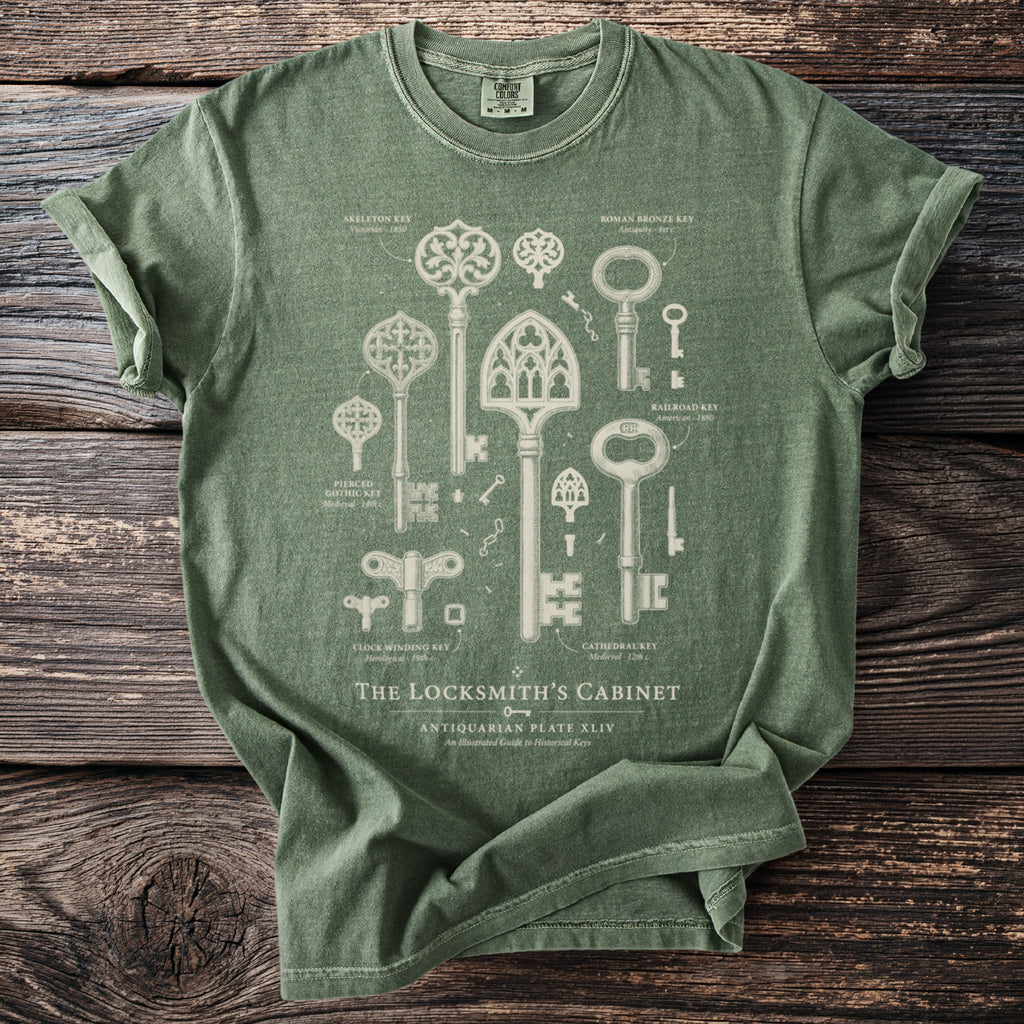Green t-shirt with vintage key illustrations and text "The Locksmith's Cabinet".